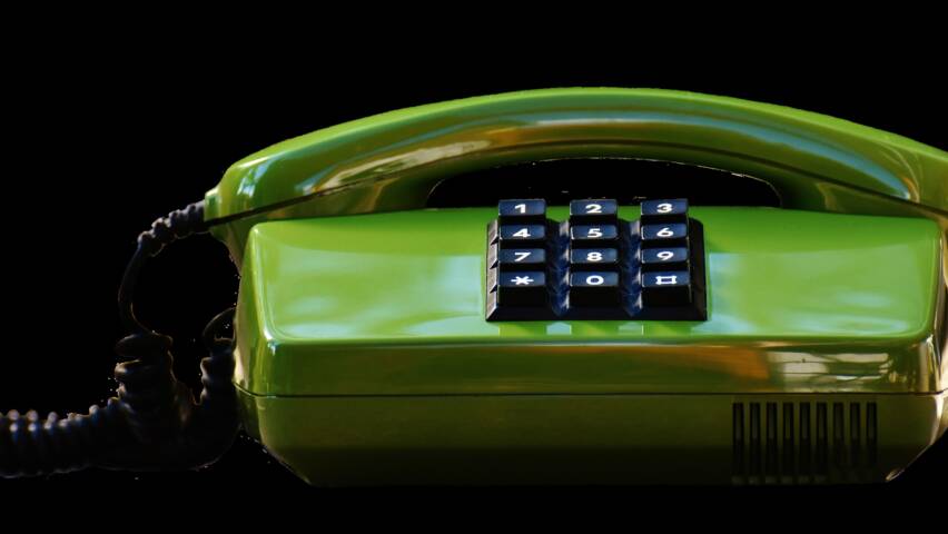 grön trådtelefon.